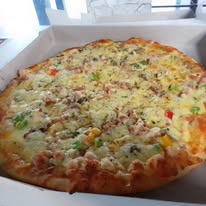 Cheesy pizza in delivery box