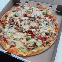 Colourful pizza with red pepper toppings